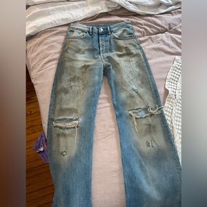 Acne Studios x Kylie Jenner Mud stained distressed denim jeans